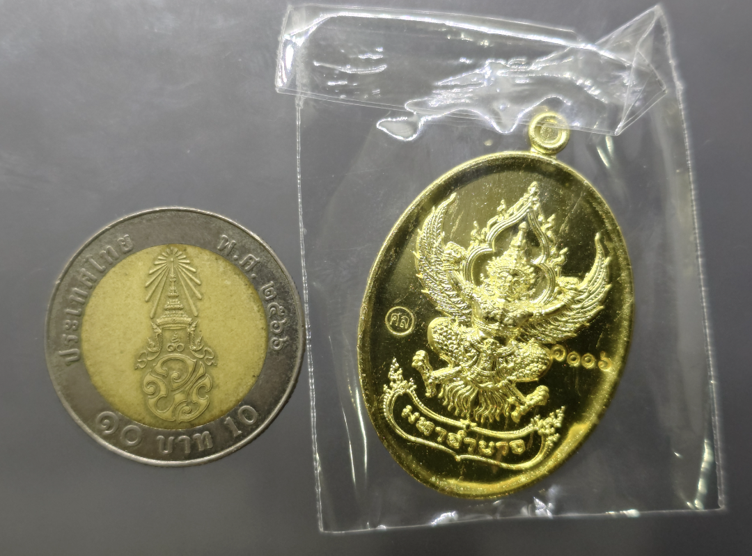 เหรียญพญาครุฑ หลวงปู่ศิลา รุ่นมหาอำนาจ มหาบารมี เนื้อทองทิพย์ วัดพระธาตุหมื่นหิน จ.กาฬสินธุ์ ปี 2567 (ซีลเดิม ไม่แกะ ลุ้นเลขโค๊ท)